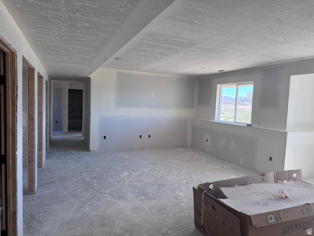 5777 West 4100 South Hooper, UT 84315 - Photo 26 of 41 Spare room with a textured ceiling