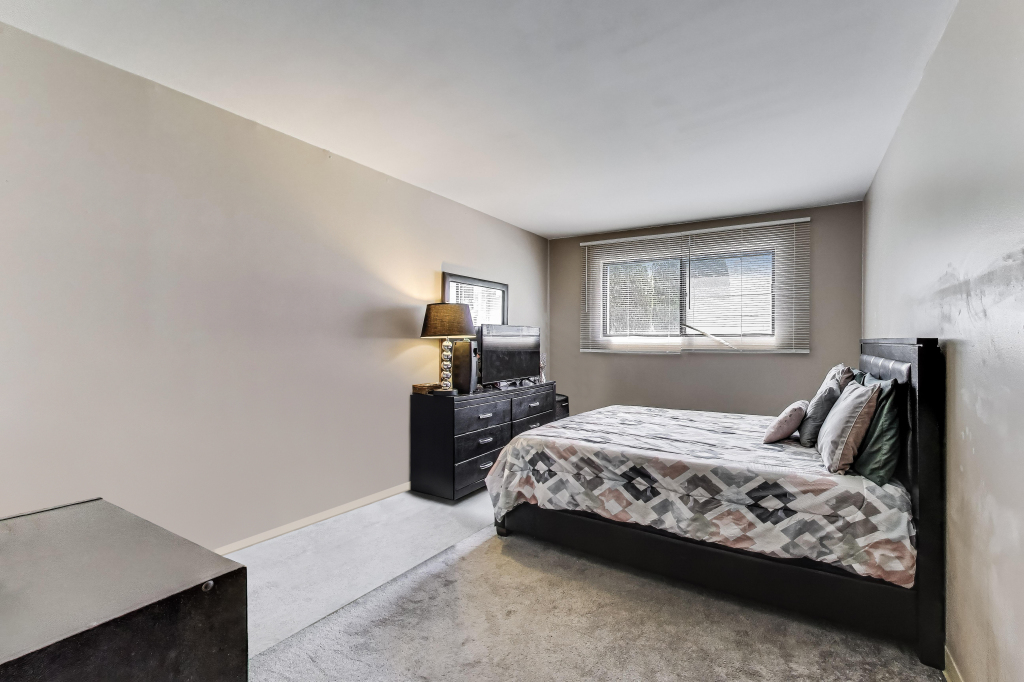 5113 North East River Road, Unit 1M Chicago, IL 60656 - Photo 21 of 25 a bedroom with bed and window