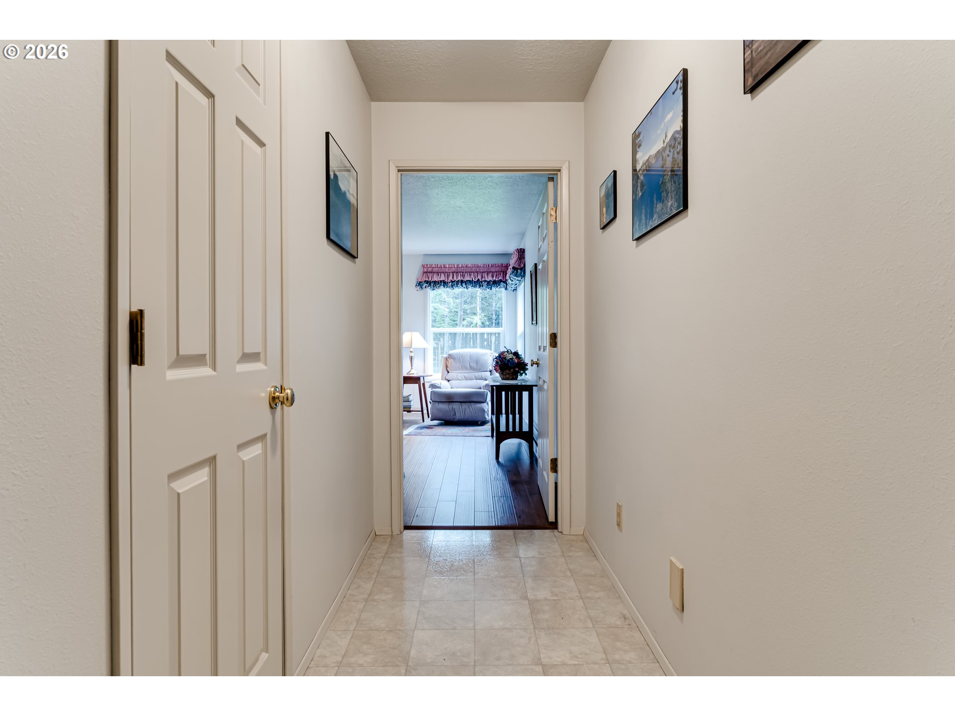 87919 Huston Road Veneta, OR 97487 - Photo 14 of 32 a view of a hallway with wooden floor and furniture