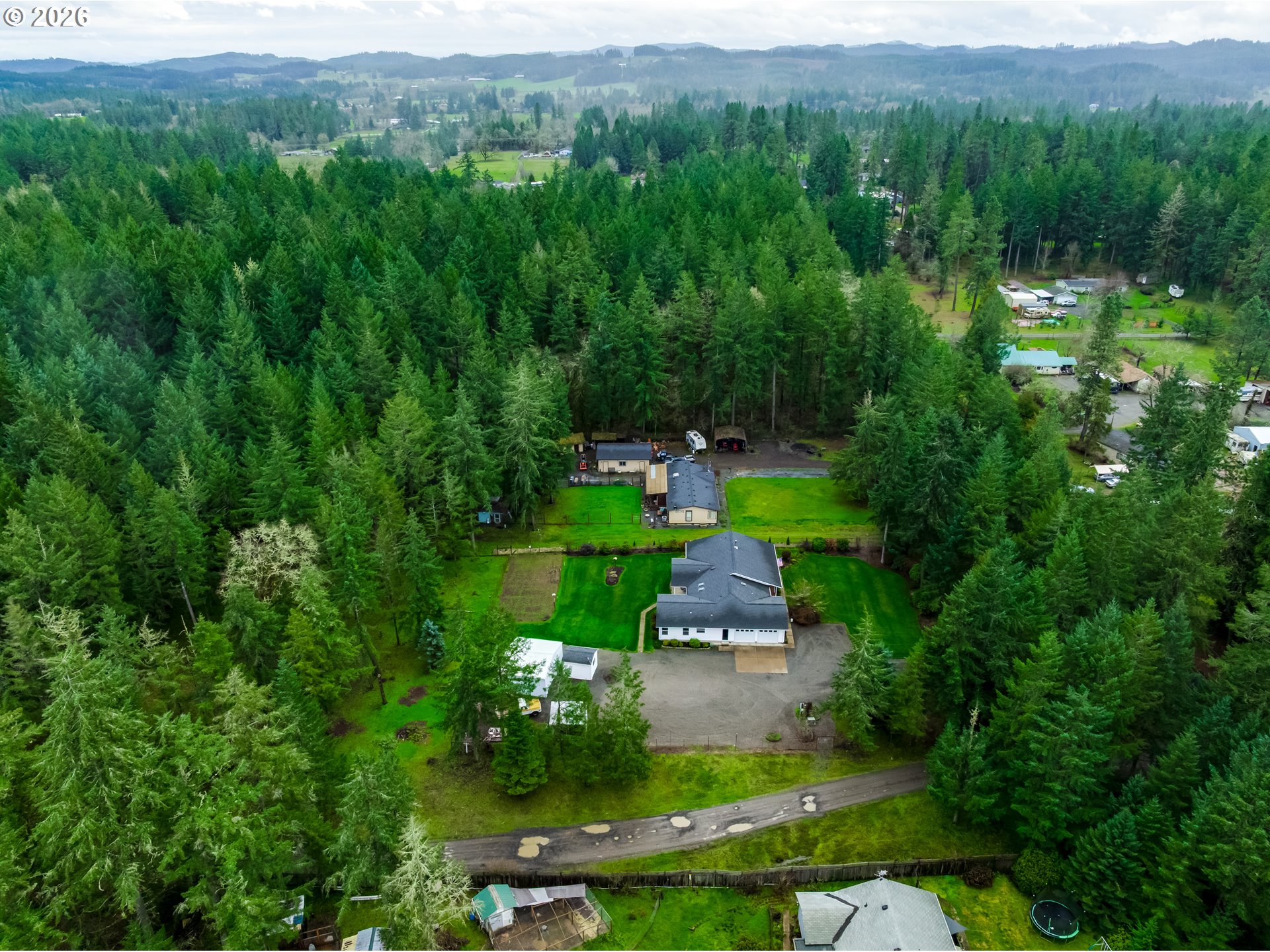 87919 Huston Road Veneta, OR 97487 - Photo 31 of 32 a view of a garden with large trees