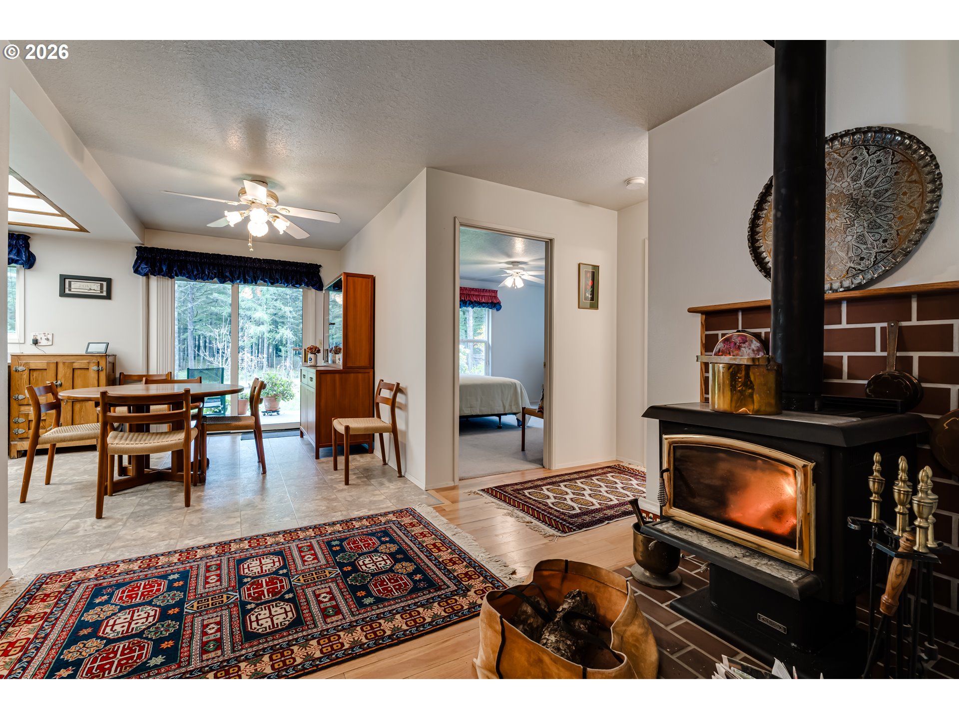 87919 Huston Road Veneta, OR 97487 - Photo 5 of 32 a living room with furniture and a fireplace
