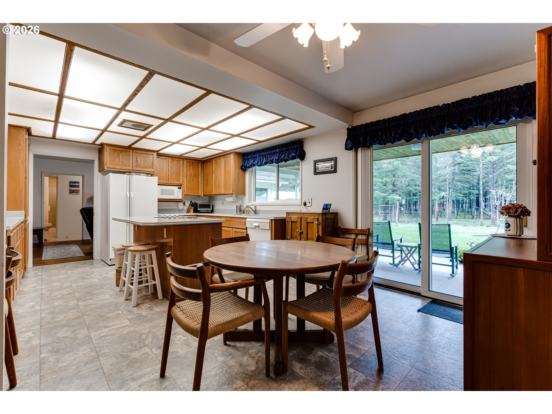 87919 Huston Road Veneta, OR 97487 - Photo 6 of 32 a dining room with furniture window and wooden floor