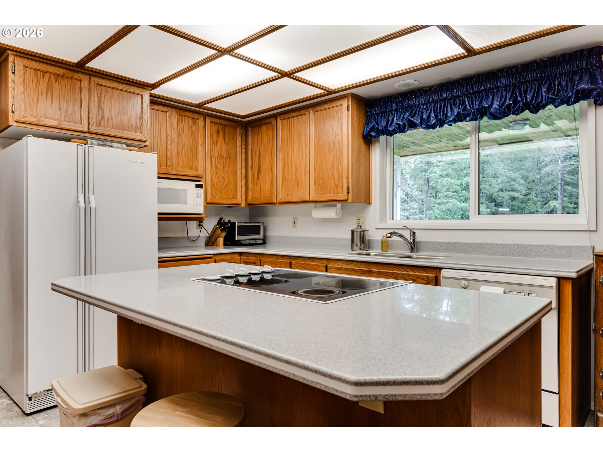 87919 Huston Road Veneta, OR 97487 - Photo 7 of 32 a kitchen with stainless steel appliances granite countertop a sink a refrigerator and a stove