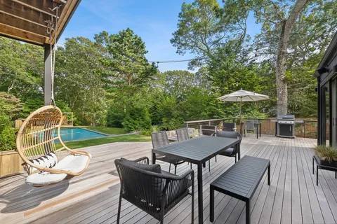 swimming pool view with a seating space