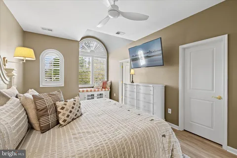 a room with pool table and windows
