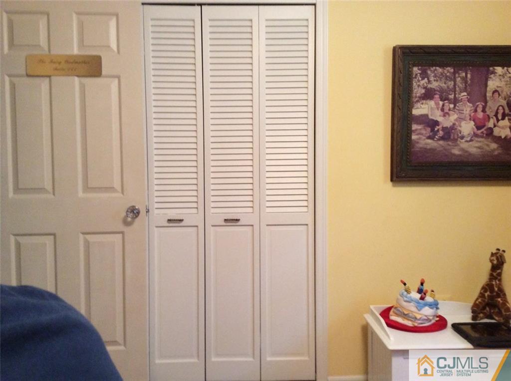 17 Timber Road East Brunswick, NJ 08816 - Photo 22 of 22 a view of a bedroom with a bed and a bookshelf