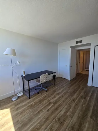 a room with furniture and a wooden floor