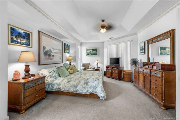 a bedroom with furniture and a window