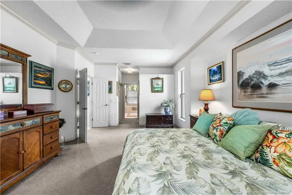 a bedroom with a bed and a couch