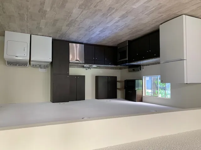 a view of a kitchen with a sink