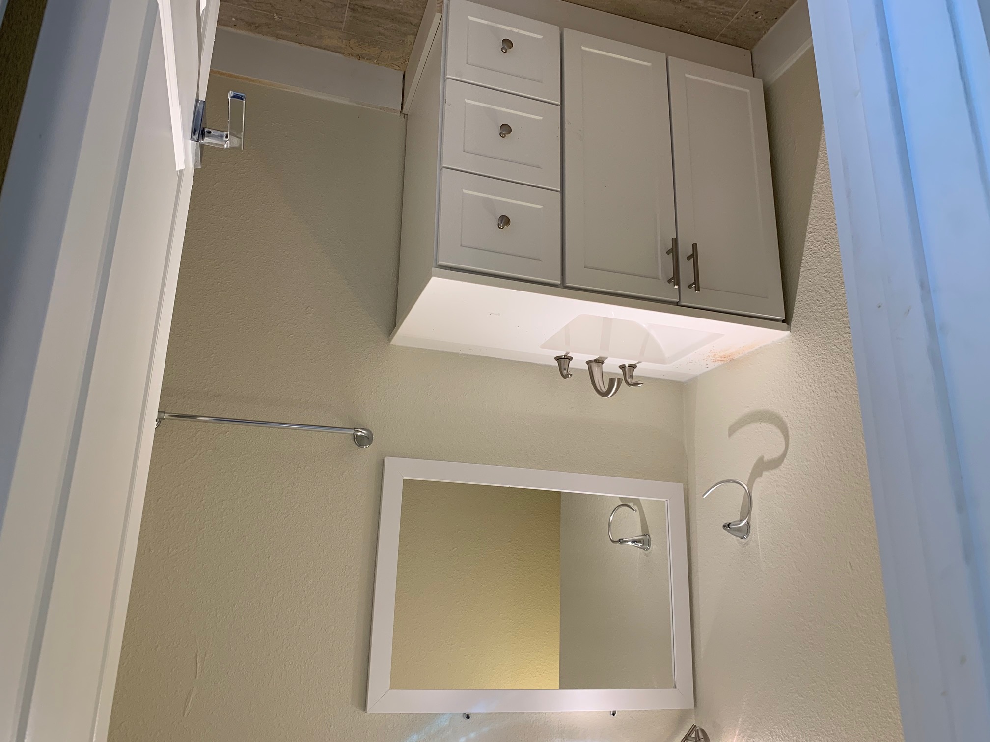 1412 Vargas Road, Unit B Austin, TX 78741 - Photo 2 of 10 a bathroom with a sink and a mirror