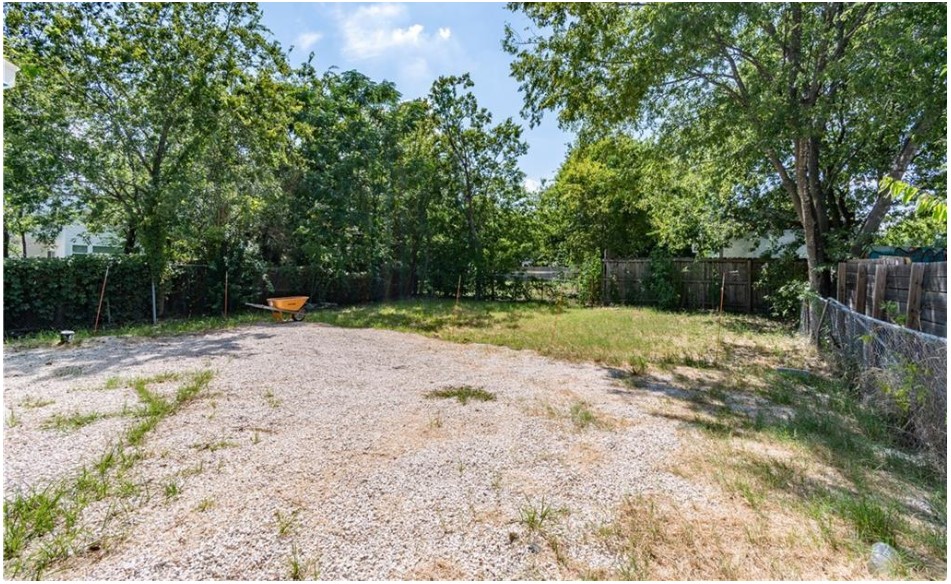 1412 Vargas Road, Unit B Austin, TX 78741 - Photo 7 of 10 a view of a backyard with large trees