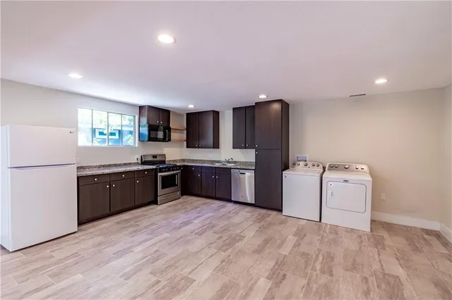 a view of a backyard with large trees