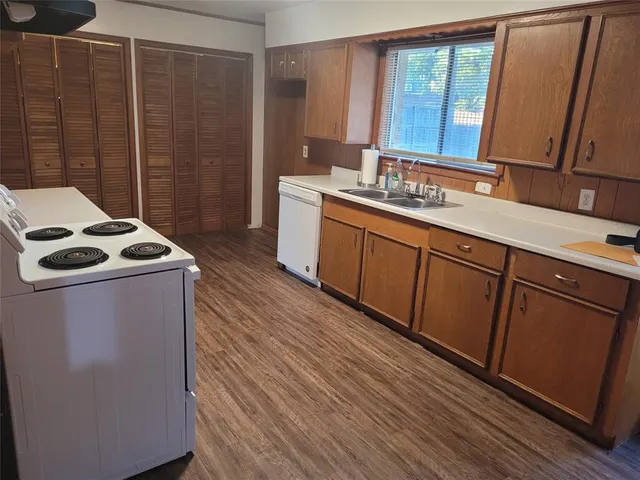a utility room with sink dryer and washer