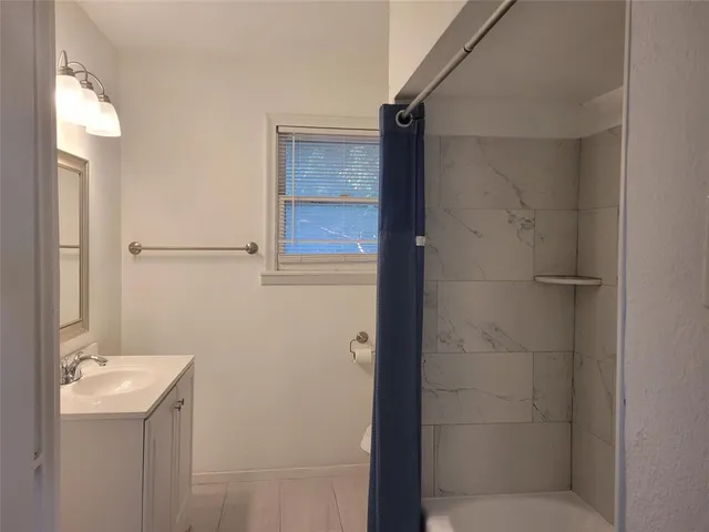 a bathroom with a sink and mirror