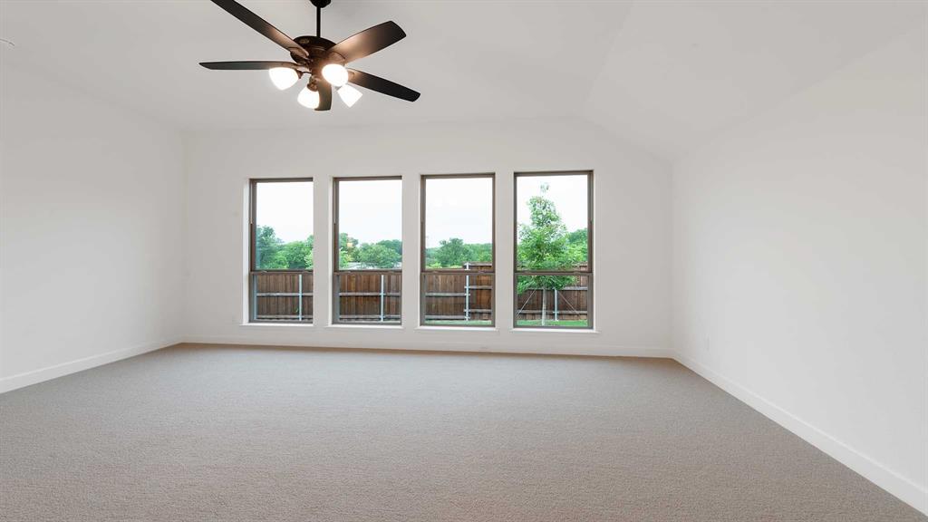 829 Stoney Bridge Way Lavon, TX 75166 - Photo 17 of 35 a view of room with a ceiling fan and window