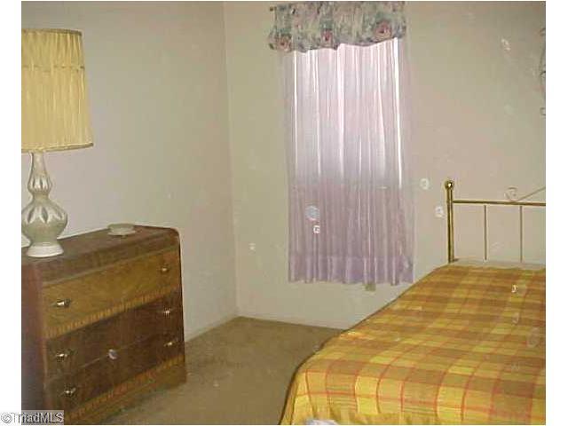 5747 Bramblegate Road, Unit G Greensboro, NC 27409 - Photo 11 of 14 1st Bedroom. Unit has 2 bedroom suites, each with double closets and private bath.