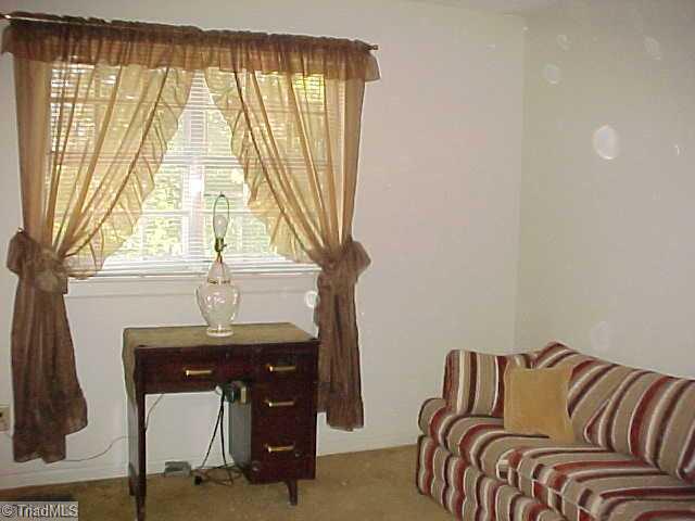 5747 Bramblegate Road, Unit G Greensboro, NC 27409 - Photo 13 of 14 2nd Bedroom. Currentlly set up as a sewing room/den this comfortable back bedroom is as nice as the master room