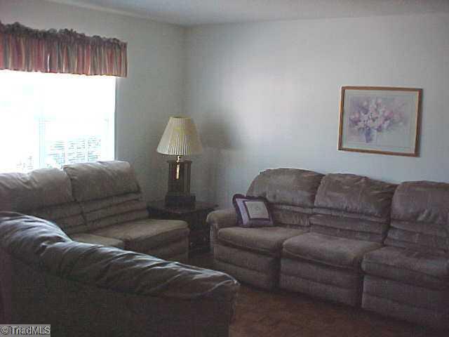 5747 Bramblegate Road, Unit G Greensboro, NC 27409 - Photo 3 of 14 Living Room. Living room will accomodate at least 10 people seated, perhaps more.