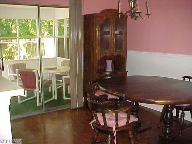 5747 Bramblegate Road, Unit G Greensboro, NC 27409 - Photo 6 of 14 Dining Room. Dining rooms seats six or more comfortably, sceened porch (viewed through glass door) will accomodate even more!