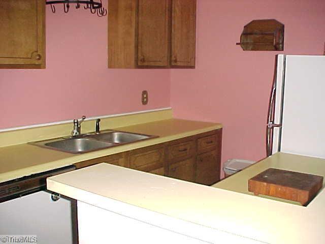 5747 Bramblegate Road, Unit G Greensboro, NC 27409 - Photo 7 of 14 Kitchen. Kitchen has plenty of cabinet space.
