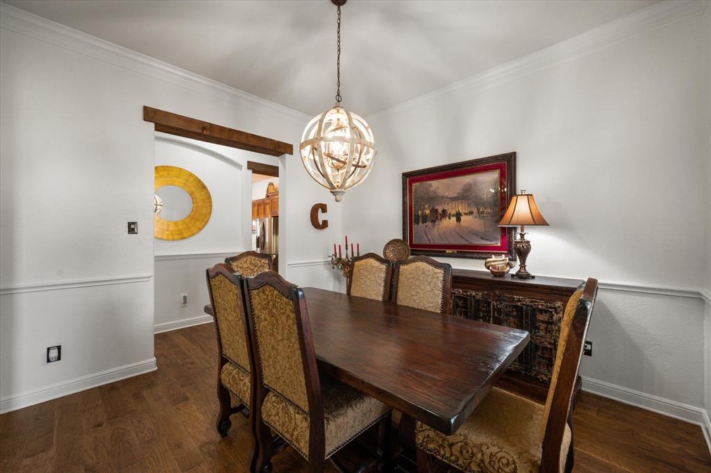 3840 Angela Court Midlothian, TX 76065 - Photo 11 of 40 a view of a dining room with furniture and chandelier