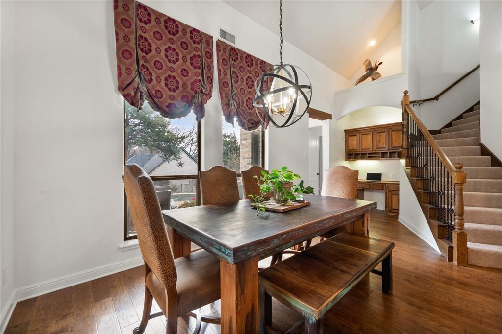 3840 Angela Court Midlothian, TX 76065 - Photo 16 of 40 a view of a dining room with furniture and wooden floor