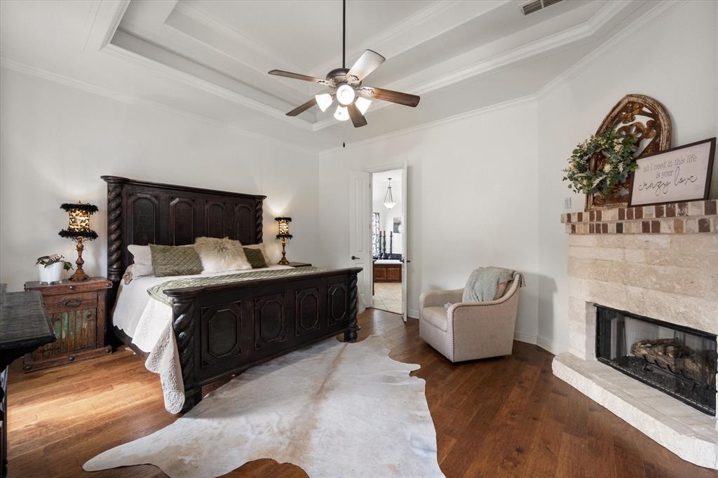 3840 Angela Court Midlothian, TX 76065 - Photo 19 of 40 a bed room with a bed and a fireplace