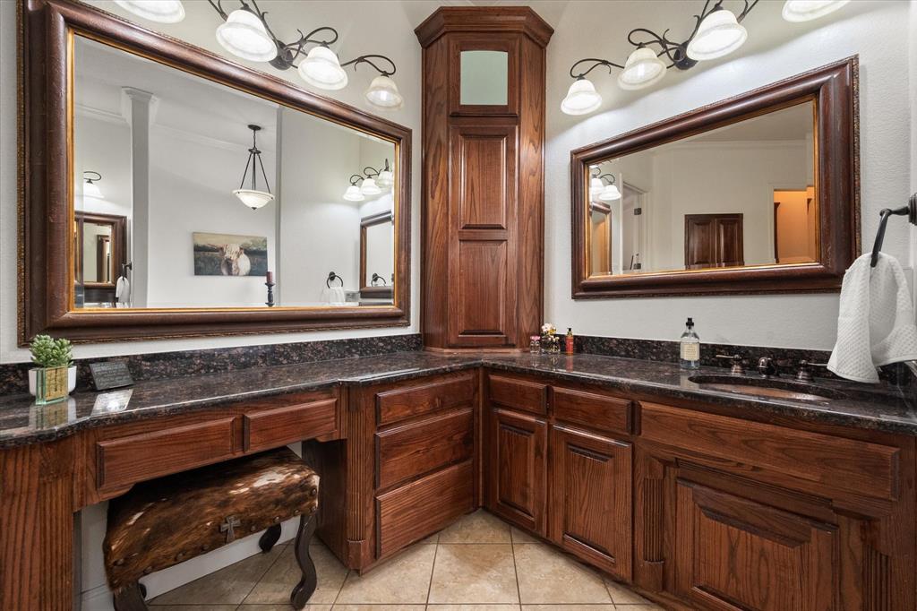 3840 Angela Court Midlothian, TX 76065 - Photo 22 of 40 a bathroom with a granite countertop sink and a mirror