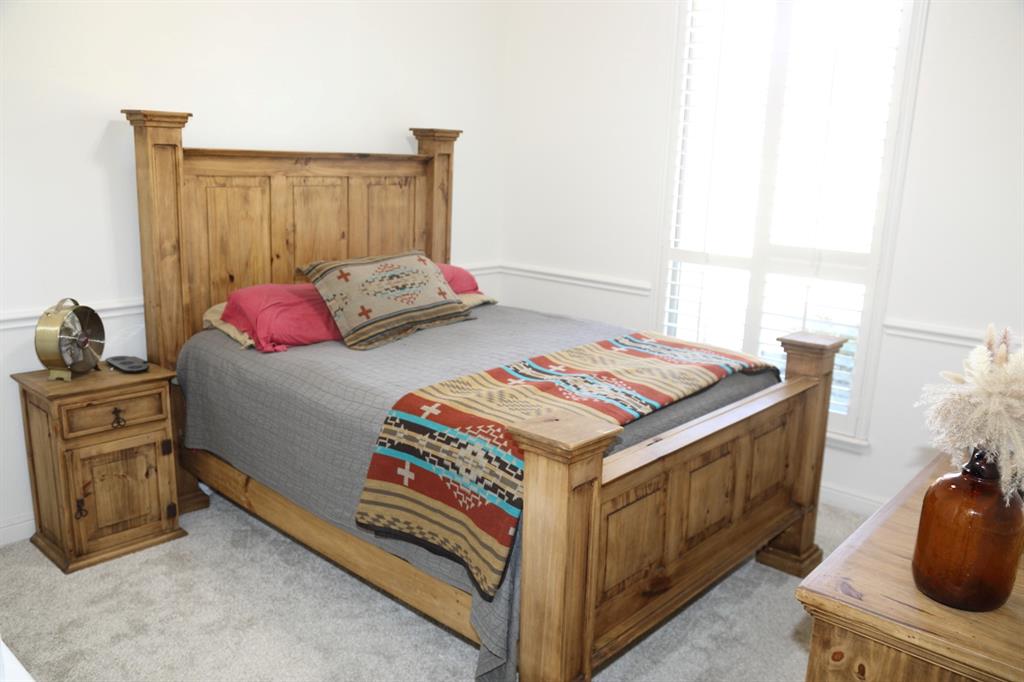 3840 Angela Court Midlothian, TX 76065 - Photo 26 of 40 a bedroom with a bed and a dresser