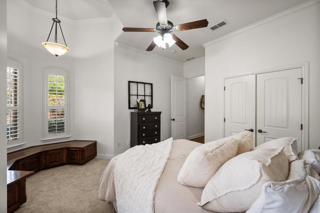 3840 Angela Court Midlothian, TX 76065 - Photo 29 of 40 a bedroom with a bed and a chandelier