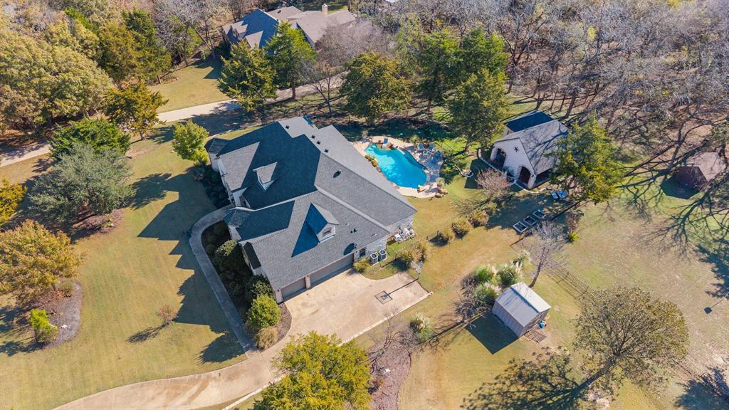 3840 Angela Court Midlothian, TX 76065 - Photo 4 of 40 an aerial view of a house with a yard