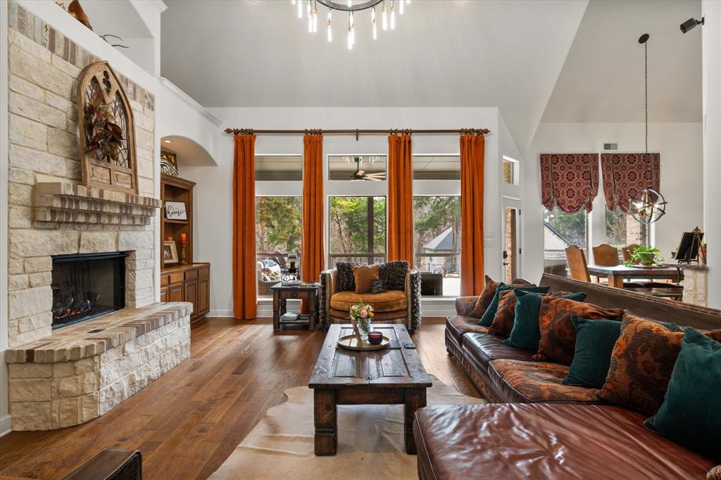 3840 Angela Court Midlothian, TX 76065 - Photo 7 of 40 a living room with furniture large window and a fireplace