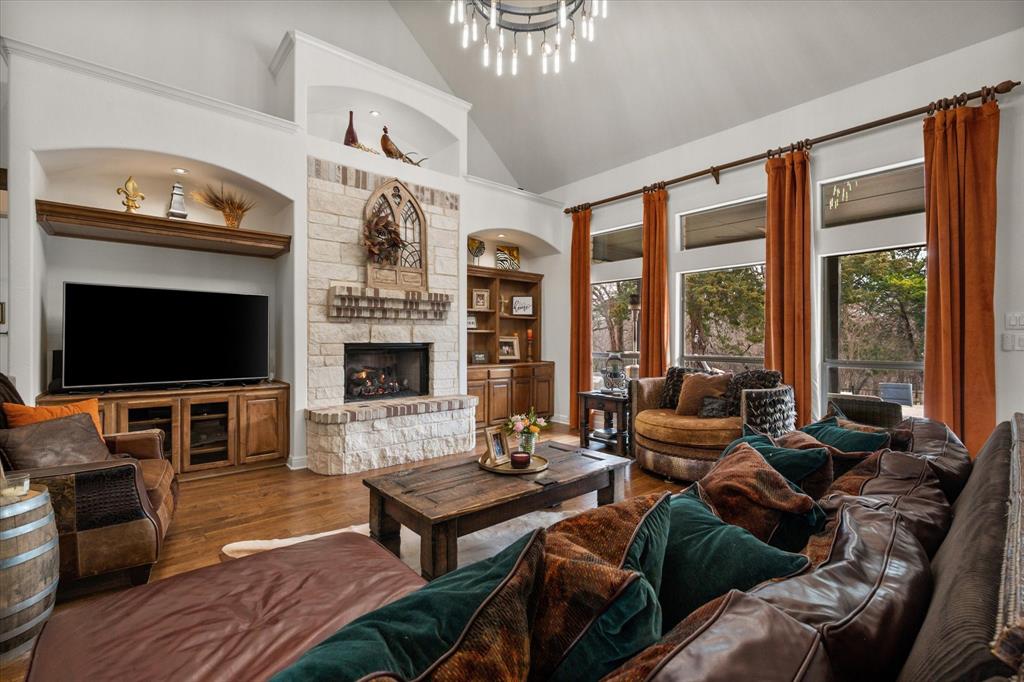 3840 Angela Court Midlothian, TX 76065 - Photo 9 of 40 a living room with furniture a flat screen tv and a fireplace