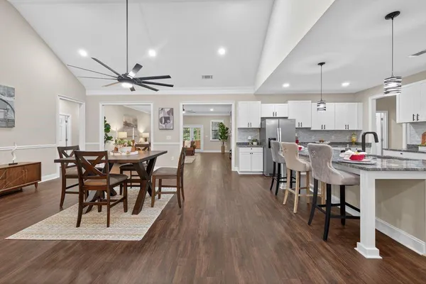a view of a dining area with furniture and wooden floor