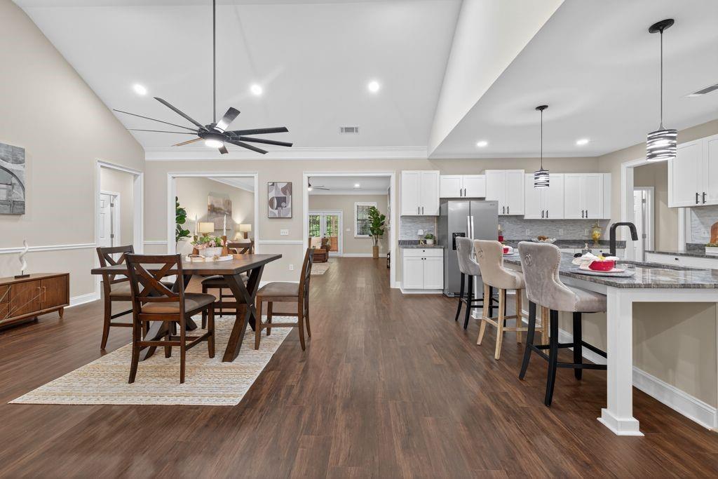 338 Mt Zion Road Oxford, GA 30054 - Photo 14 of 33 a view of a dining area with furniture and wooden floor