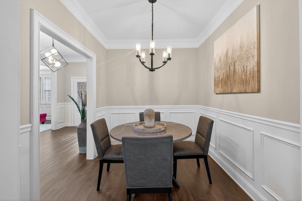 338 Mt Zion Road Oxford, GA 30054 - Photo 15 of 33 a view of a dining room with furniture window and wooden floor