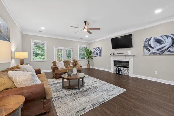 a living room with furniture and a flat screen tv