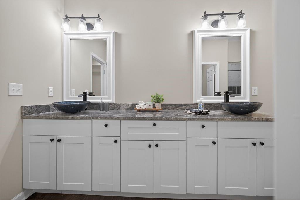 338 Mt Zion Road Oxford, GA 30054 - Photo 21 of 33 a bathroom with white cabinets and a sink