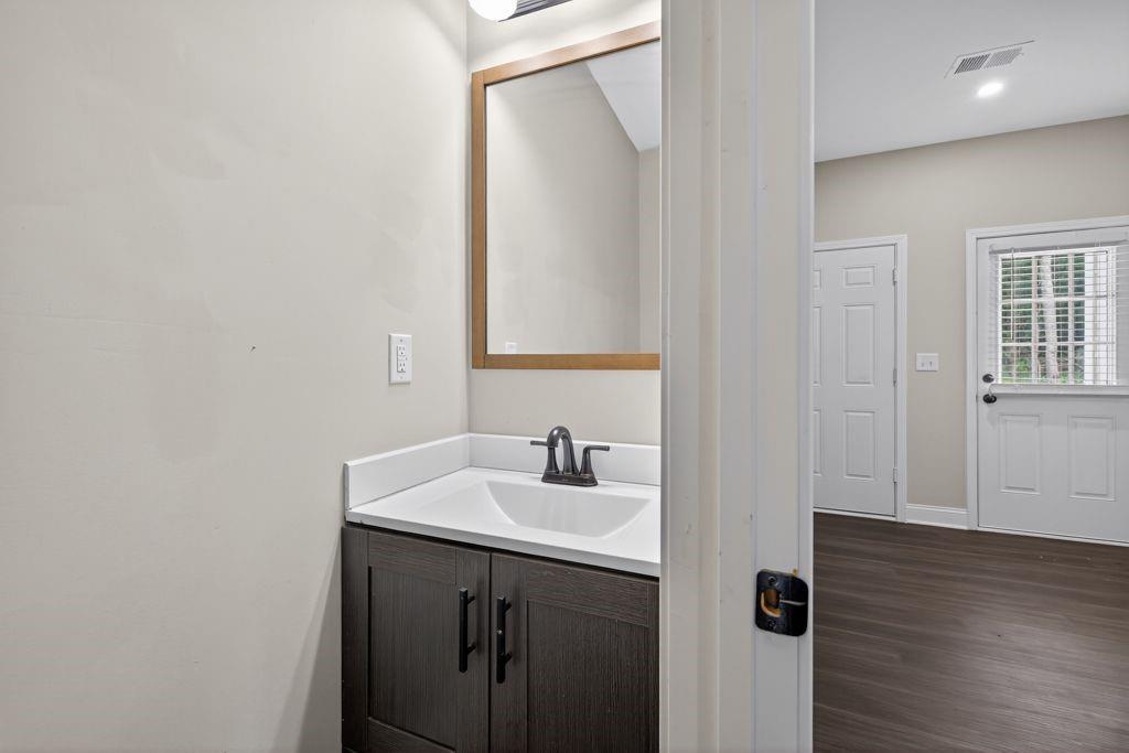 338 Mt Zion Road Oxford, GA 30054 - Photo 28 of 33 a bathroom with a sink and a mirror