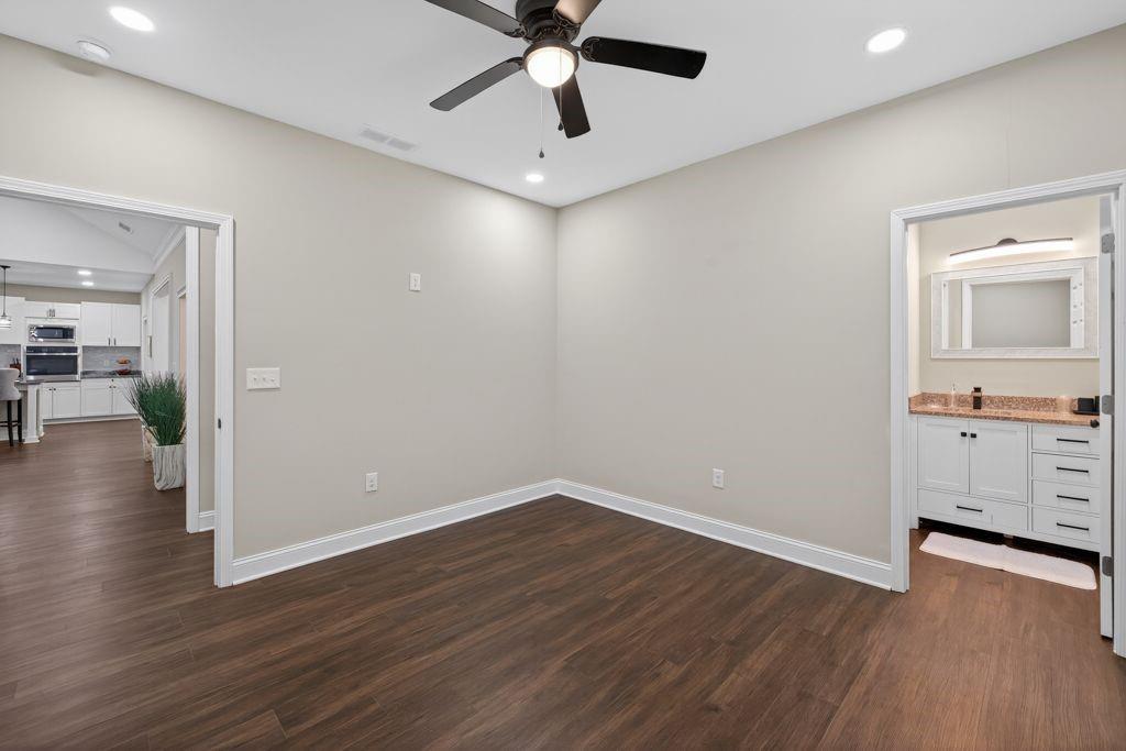 338 Mt Zion Road Oxford, GA 30054 - Photo 31 of 33 wooden floor in an empty room with a window