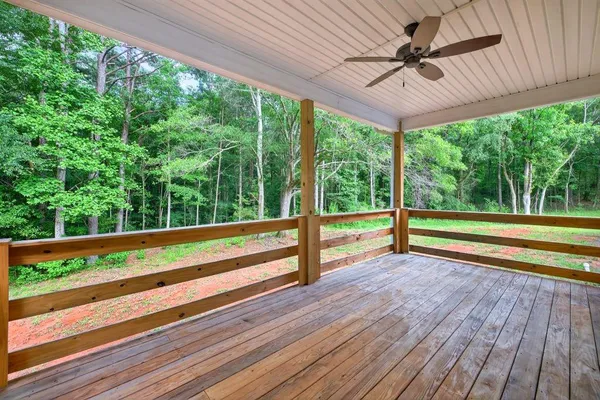 a view of a room with wooden floor and outdoor space