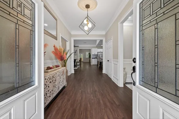 a view of gallery with wooden floor