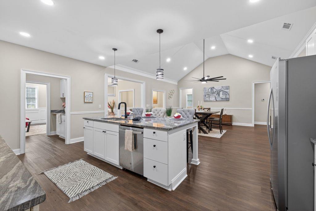 338 Mt Zion Road Oxford, GA 30054 - Photo 8 of 33 a kitchen with sink stove and view living room