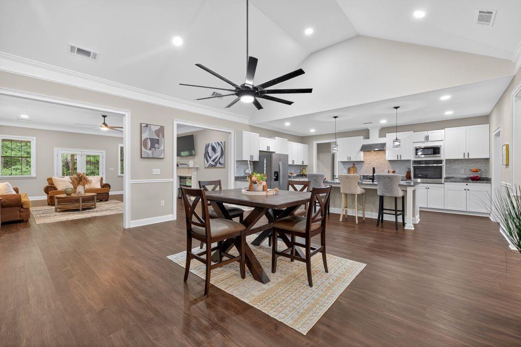 338 Mt Zion Road Oxford, GA 30054 - Photo 10 of 33 a view of a dining area with furniture and wooden floor