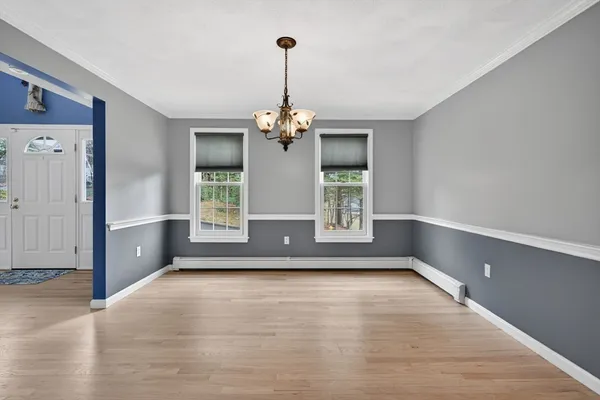 a view of room with window and hardwood floor