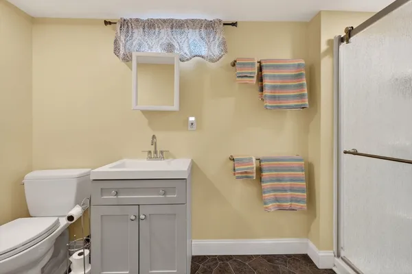 a spacious bedroom with a bed and a couch