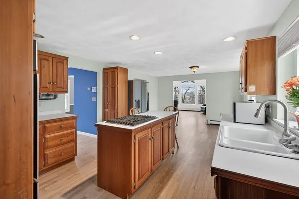 a kitchen with stainless steel appliances granite countertop a stove and a refrigerator