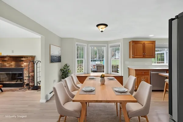a dining room with furniture window and fire place