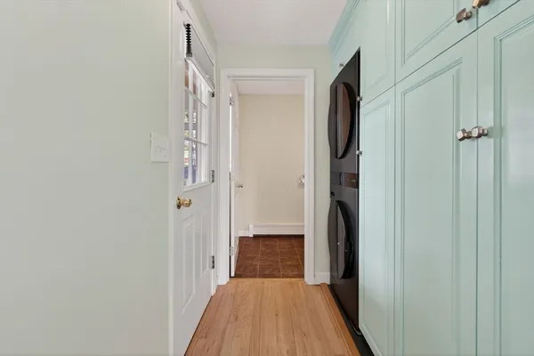 a view of hallway with wooden floor